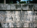 12 wall of mayan faces in the tulum ruins in mexico