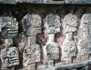 19 mayan wall of faces in the ruins of tulum